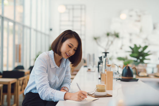 Women enjoying writing in a journal.